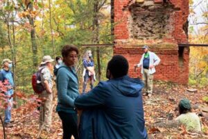 Hikers at the Bartlett Tower ruins in Tariffville along the New England National Scenic Trail