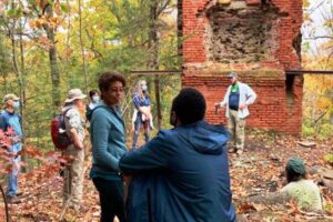 Hikers at the Bartlett Tower ruins in Tariffville along the New England National Scenic Trail