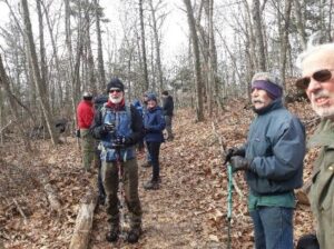 Photograph of hikers listening to board member Dale Bertoldi